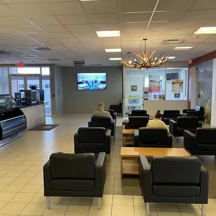 Main service area lobby. Large TVs, plenty of seating and a kids zone as well.