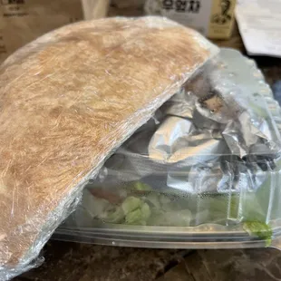 a sandwich in a plastic container