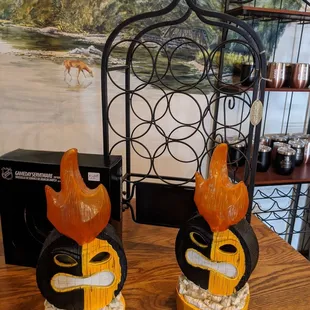 two ceramic figurines on a table