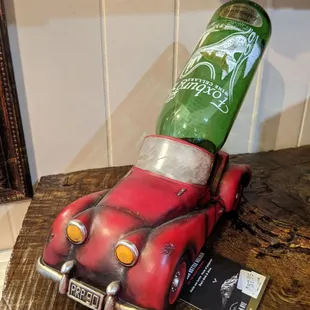 a red car with a bottle on top