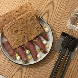 Fish pastrami with bread crisps