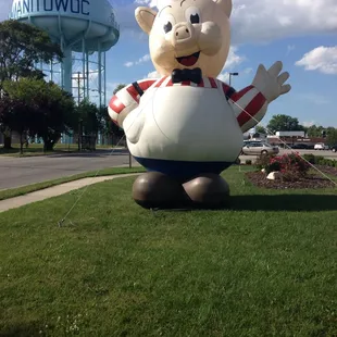 a giant piggy with a bow tie