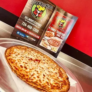 a cheesy pizza on a tray