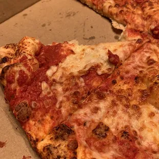 Gross red pizza missing all pepperoni.