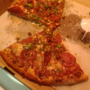 a half eaten pizza in a box