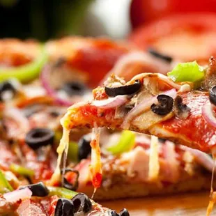 a pizza with olives and peppers