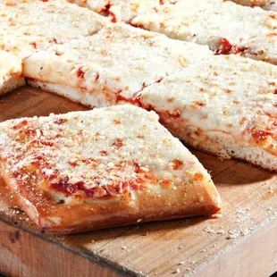 a sliced pizza on a cutting board