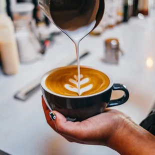 a bari serving a cup of coffee
