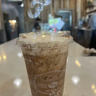 Cafe Con Leche with cold foam, almond milk with cinnamon