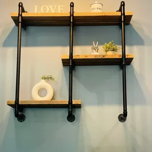a shelf with two shelves and a vase