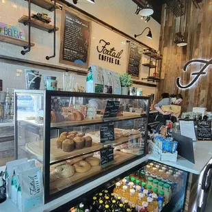 a display of various drinks and pastries