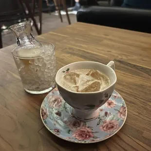 a cup of coffee and a glass of water