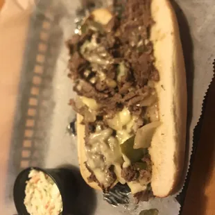 a sandwich with a side of coleslaw