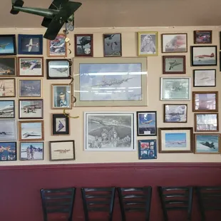 a wall full of pictures