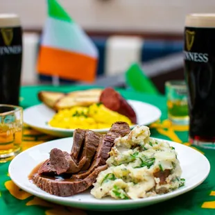 a plate of meat and mashed potatoes