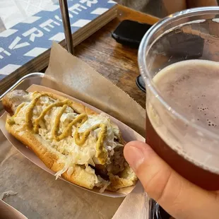 German brat with sauerkraut and beer cheese.  I enjoyed it