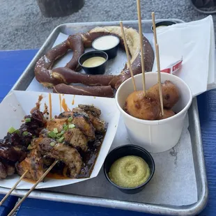 Here is the chicken skewers, corndog bites, huge pretzel