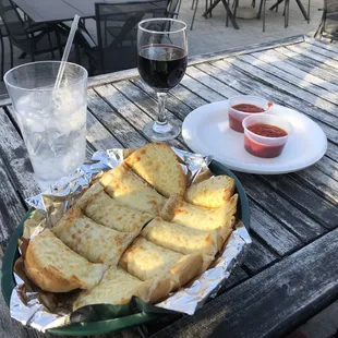 a plate of bread and a glass of wine