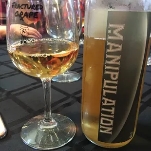 a glass of wine and a bottle of wine