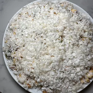 a white plate of rice