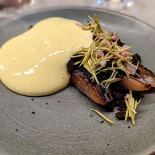 October 13, 2022; Caramelized shallots with pumpernickel, ramp, and spruce.