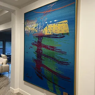 Chihuly tapestry mounted and finished with a float frame