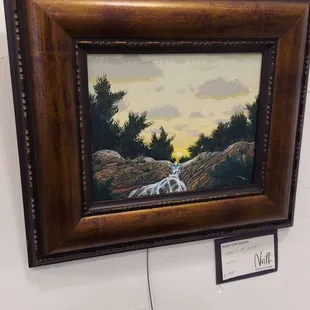 One of my paintings framed.