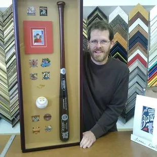 Is there a sports fan in your life? Custom frame some memorabilia for a great holiday gift. (We frame sports jerseys, too!)