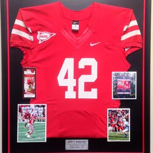 Frame you son or daughter's team jersey. Include photos and a plate to preserve the memories.