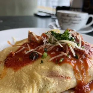 A-Mish crepe- bacon, tomato sauce and red peppers, mushrooms and black olive