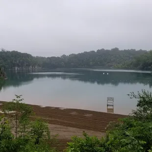 The old quarry now a swimming and scuba diving area this pic was taken just after a rain storm thats why no body on the beach