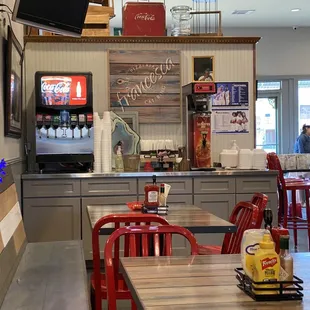 a dining area with tables and chairs