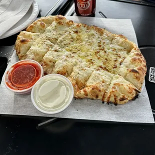 a pizza with sauce and condiments