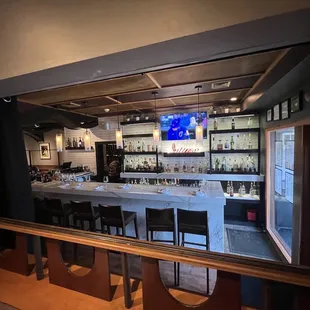 a view of the bar from the dining room