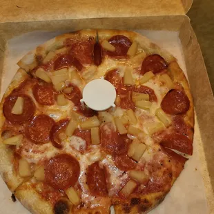 Their pepperoni/pineapple personal pizza is delicious.  After tax, $17.95