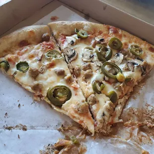 Sausage, mushroom, and jalapeño pizza.