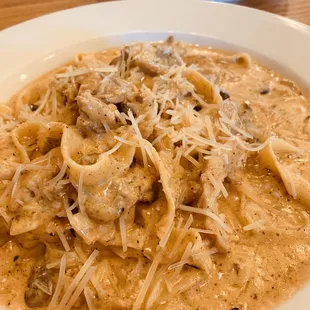 Really awesome blackened chicken and mushrooms with Alfredo sauce over fettuccine.