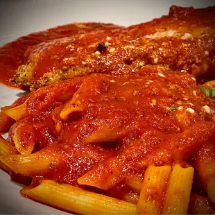 Chicken Parmesan with penne pasta.