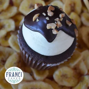 "Banana Dip." You dip, we dip. Chocolate or vanilla cake, banana frosting and chocolate ganache w/nuts.