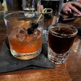 two glasses of alcohol on a table