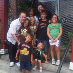 a group of children and a man