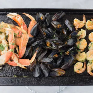 Sizzling Iron Skillet Roasted Super Combo Mussels, Shrimp and Dungeness Crab