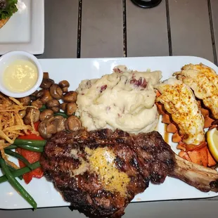 12oz Bone-in Ribeye w/2 Lobster tail &apos;toppings&apos; and Garlic Mash...Crispy French Beans, Bell Peppers, Baby Belles, and Crispy Onions...