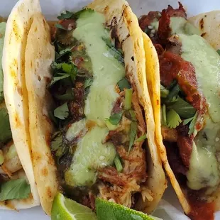 three tacos on a tray