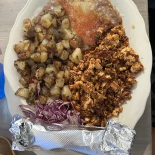 Chorizo and eggs served with papas mexicanas and refried beans (lard free and vegetarian).