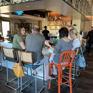 people sitting at the bar