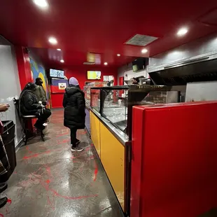 a woman standing in a restaurant