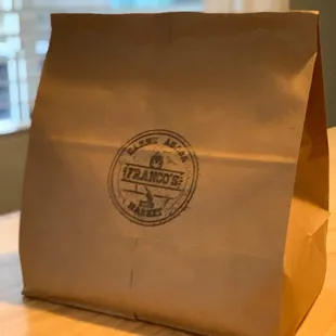 a brown paper bag on a table
