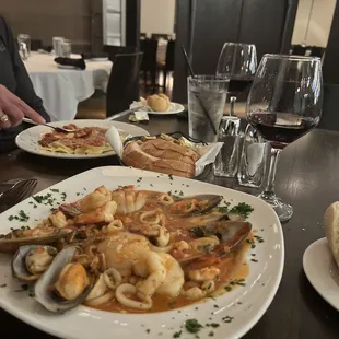 Yummy  seafood pasta   Great house wine too !! Love this place all around