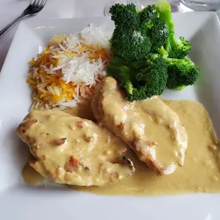 Dijon chicken breast, steamed broccoli and two colors of very nice basmati (?) rice.